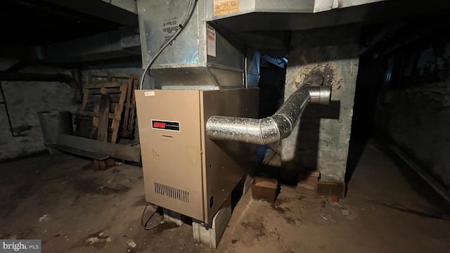 utility room featuring heating unit
