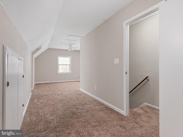 bonus room featuring carpet, lofted ceiling, and baseboards