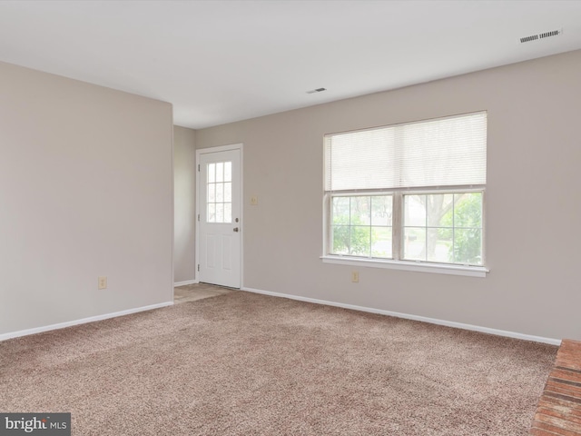 interior space featuring baseboards and visible vents