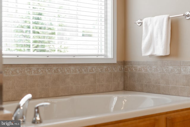 full bathroom featuring a bath