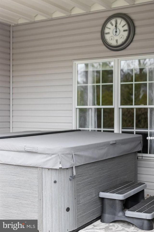 exterior space with a hot tub