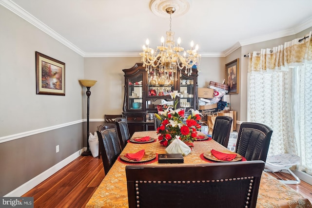 6301 Bradford Ct, Frederick, MD 21701 - dining room featuring baseboards, an inviting chandelier, crown molding, and wood finished floors