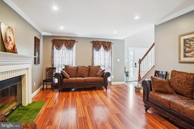 6301 Bradford Ct, Frederick, MD 21701 - living room with ornamental molding, baseboards, stairway, and wood finished floors