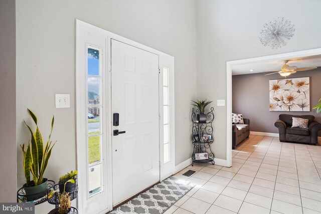 6301 Bradford Ct, Frederick, MD 21701 - foyer entrance featuring a healthy amount of sunlight, light tile patterned floors, and baseboards