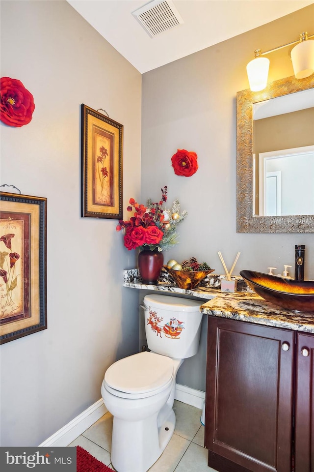 6301 Bradford Ct, Frederick, MD 21701 - half bath with vanity, baseboards, tile patterned floors, toilet, and visible vents