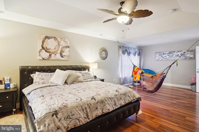 6301 Bradford Ct, Frederick, MD 21701 - bedroom with a tray ceiling, wood finished floors, baseboards, and a ceiling fan