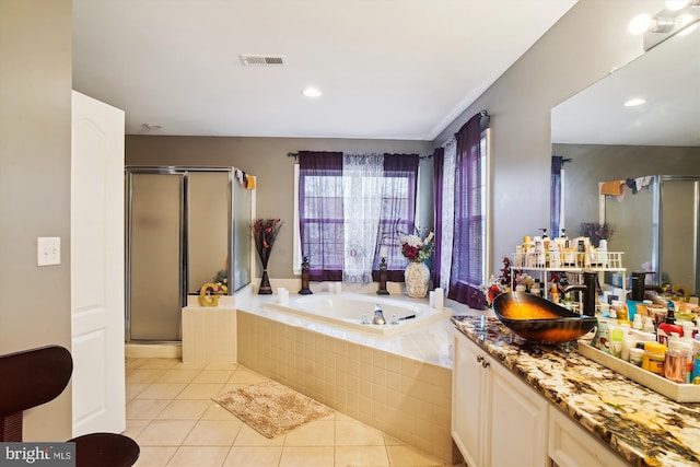 6301 Bradford Ct, Frederick, MD 21701 - full bath with visible vents, tile patterned floors, a shower stall, and a garden tub
