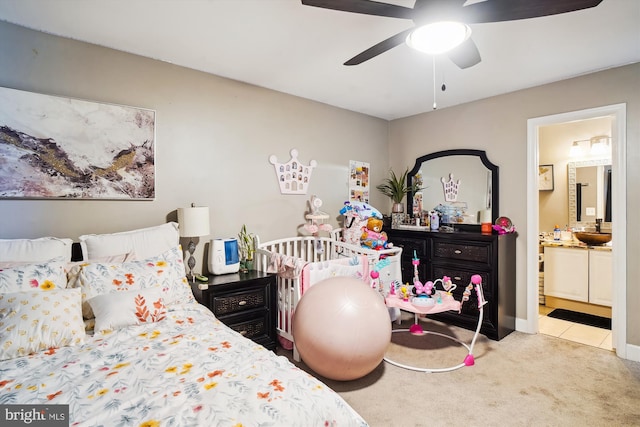 6301 Bradford Ct, Frederick, MD 21701 - carpeted bedroom featuring tile patterned floors, a ceiling fan, and connected bathroom