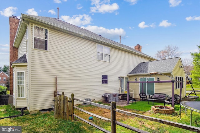 6301 Bradford Ct, Frederick, MD 21701 - back of property with entry steps, fence, a fire pit, and a chimney