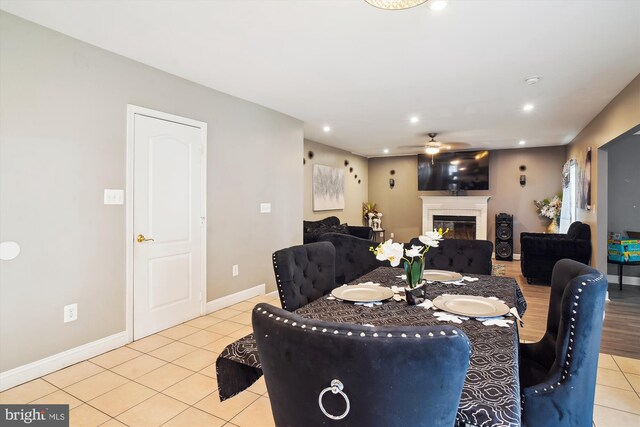 6301 Bradford Ct, Frederick, MD 21701 - dining area with ceiling fan, light tile patterned floors, a glass covered fireplace, recessed lighting, and baseboards