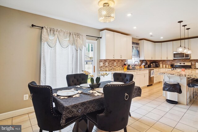 6301 Bradford Ct, Frederick, MD 21701 - dining area with baseboards, recessed lighting, and light tile patterned flooring
