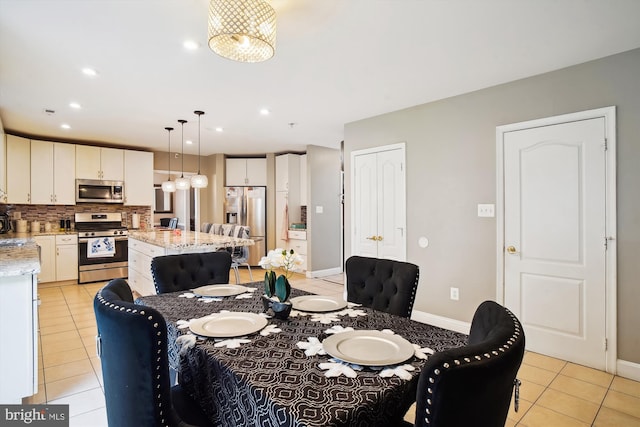 6301 Bradford Ct, Frederick, MD 21701 - dining room featuring light tile patterned flooring, baseboards, and recessed lighting