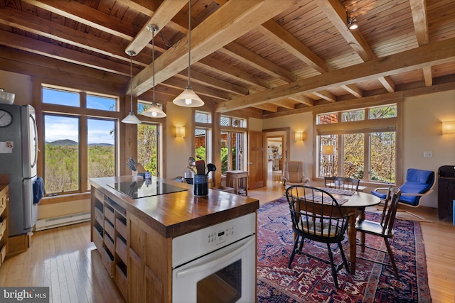 kitchen featuring wood ceiling, white oven, black electric stovetop, and wood counters
