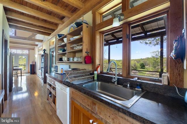 kitchen with open shelves, dark countertops, a sink, white appliances, and beamed ceiling