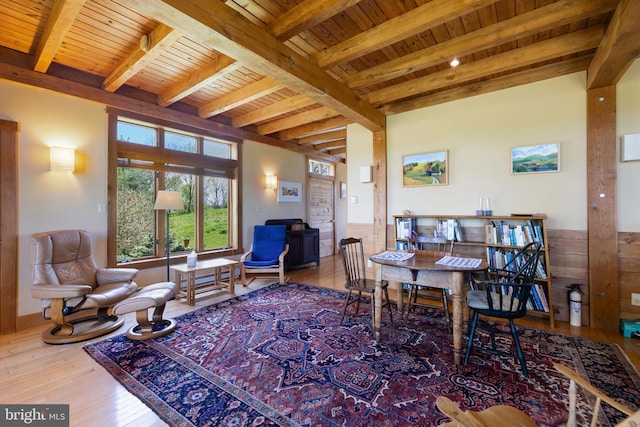 dining space with wainscoting, wooden ceiling, hardwood / wood-style floors, and beamed ceiling