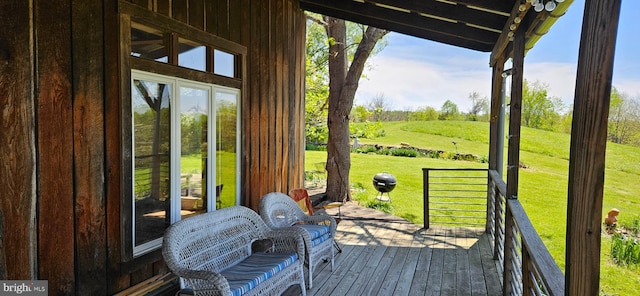 exterior space featuring wooden walls and hardwood / wood-style flooring