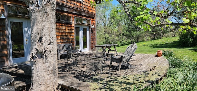exterior space with french doors and a deck