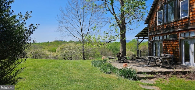 view of yard featuring a deck