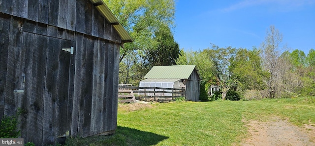 exterior space with fence and an outdoor structure
