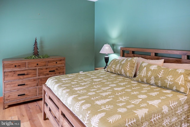 bedroom featuring wood finished floors