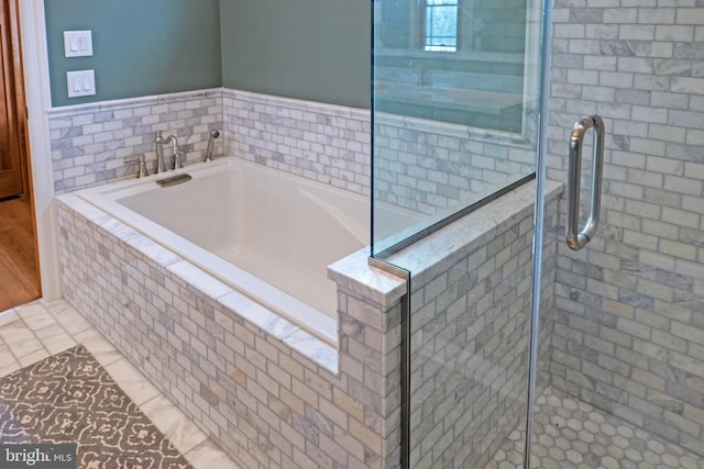 full bathroom with a garden tub and a stall shower