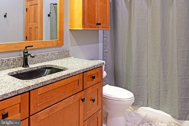 full bathroom featuring toilet and vanity