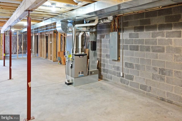 unfinished basement with heating unit and electric panel