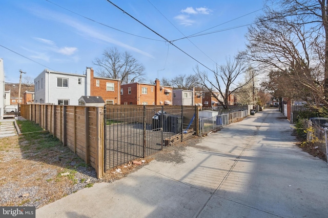 view of road with a gate and a residential view