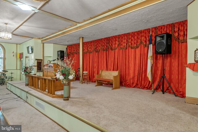 336 7th St N, Lebanon, PA 17042 - below grade area with a textured ceiling, carpet, visible vents, and a chandelier
