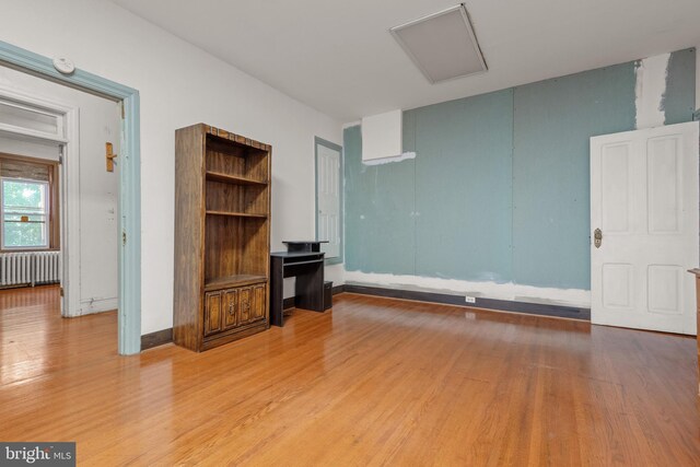 336 7th St N, Lebanon, PA 17042 - unfurnished living room with radiator and wood finished floors