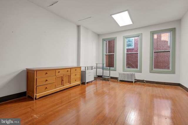 336 7th St N, Lebanon, PA 17042 - empty room with light wood-type flooring, radiator heating unit, and baseboards