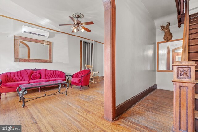 336 7th St N, Lebanon, PA 17042 - living area with baseboards, wood finished floors, an AC wall unit, and ceiling fan