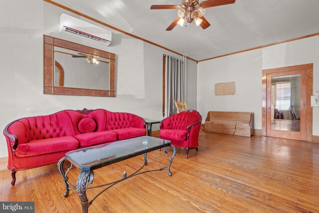 336 7th St N, Lebanon, PA 17042 - living area with a wall mounted air conditioner, wood finished floors, a ceiling fan, and ornamental molding