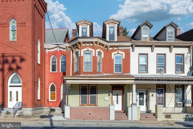 336 7th St N, Lebanon, PA 17042 - multi unit property with brick siding, cooling unit, and a porch