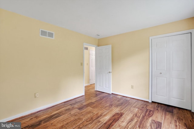 6 Deer Haven Ln, White Hall, MD 21161 - unfurnished bedroom with wood finished floors and a closet