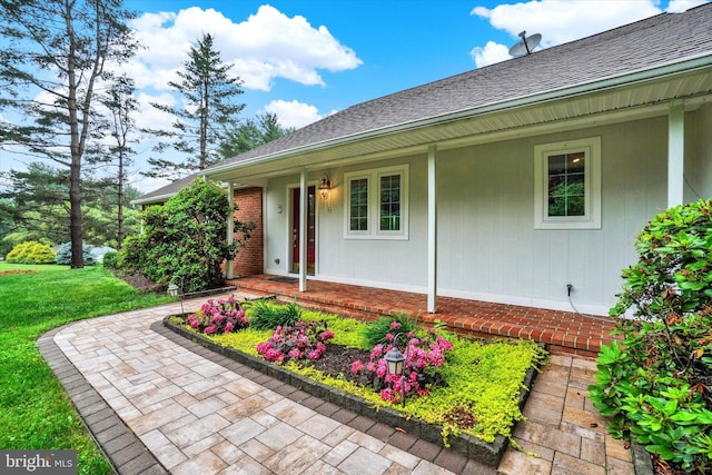 6 Deer Haven Ln, White Hall, MD 21161 - view of front of house featuring a porch, roof with shingles, and a front lawn