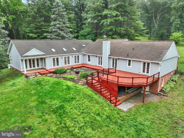 6 Deer Haven Ln, White Hall, MD 21161 - back of property with french doors, a deck, a chimney, and a lawn