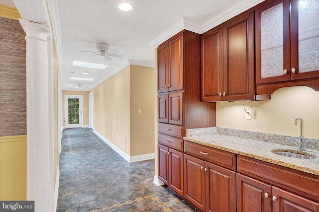 6 Deer Haven Ln, White Hall, MD 21161 - kitchen featuring a ceiling fan, light stone countertops, glass insert cabinets, and ornamental molding