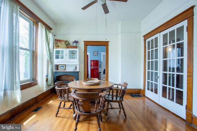 471 N Massanutten St, Strasburg, VA 22657 - dining area featuring wood finished floors, french doors, and plenty of natural light