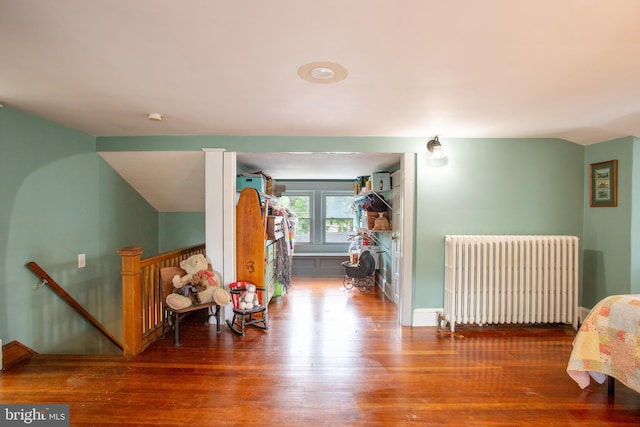 471 N Massanutten St, Strasburg, VA 22657 - hall with radiator heating unit, an upstairs landing, wood finished floors, lofted ceiling, and baseboards