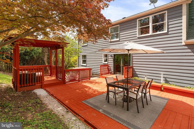wooden deck featuring outdoor dining space