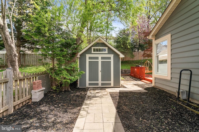 view of shed featuring a fenced backyard