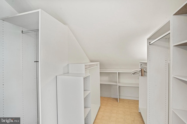 walk in closet featuring light floors