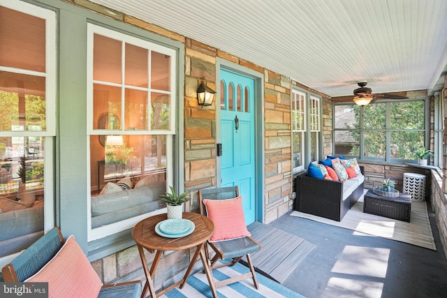 deck featuring a porch, ceiling fan, and visible vents