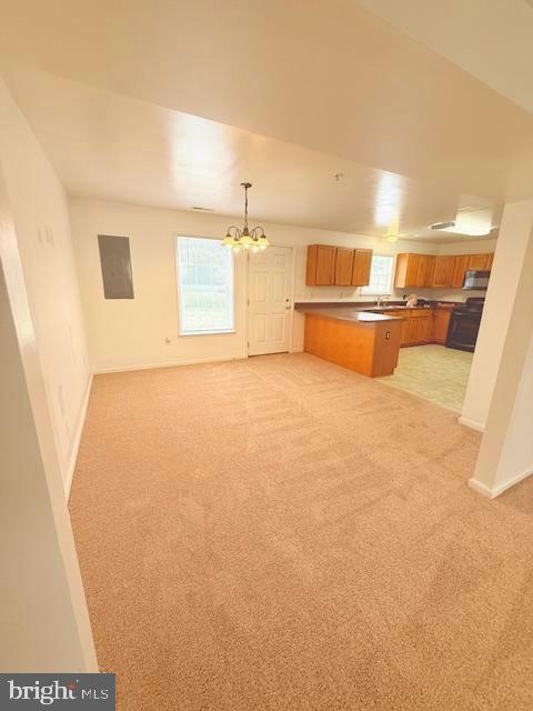 204 Carsons Ct, Pocomoke City, MD 21851 - kitchen featuring light colored carpet, a peninsula, and open floor plan