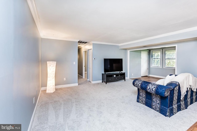 carpeted living room featuring visible vents, baseboards, and ornamental molding
