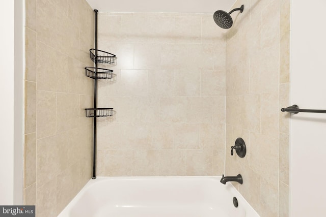 bathroom with bathing tub / shower combination