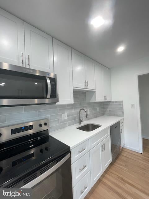 3433 Gregg Rd, Brookeville, MD 20833 - kitchen with stainless steel microwave, electric range, a sink, dishwasher, and white cabinetry