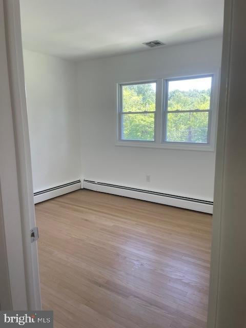 3433 Gregg Rd, Brookeville, MD 20833 - empty room with a baseboard radiator and wood finished floors