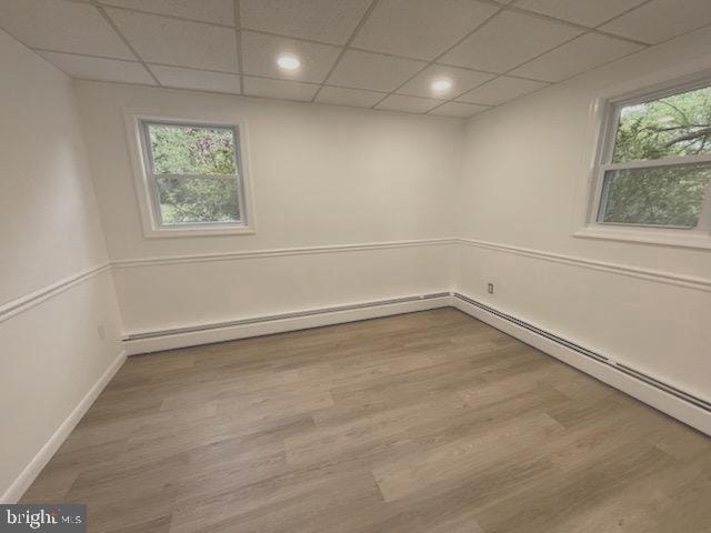 3433 Gregg Rd, Brookeville, MD 20833 - spare room featuring a paneled ceiling, healthy amount of natural light, wood finished floors, and baseboards